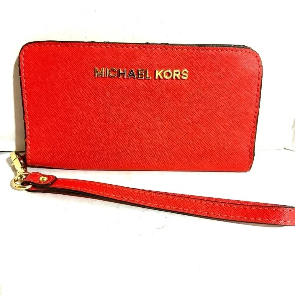 Michael Kors orange leather leather wristlet wallet